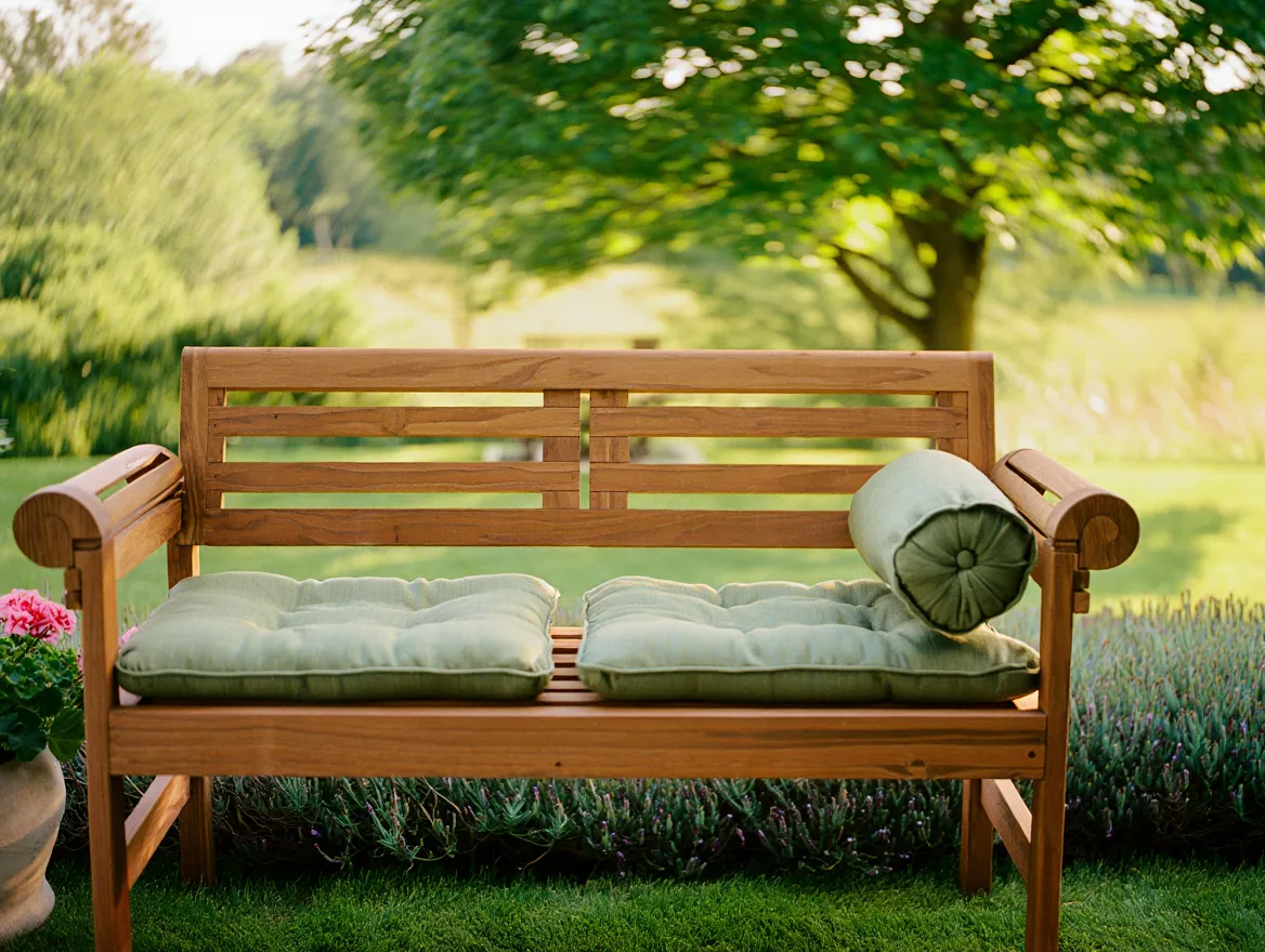 Wooden garden bench with cushions